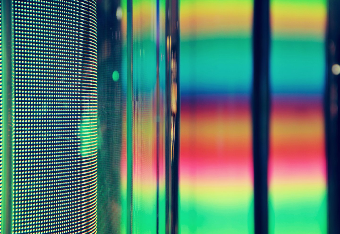 Digital display screen with colorful light streaks.